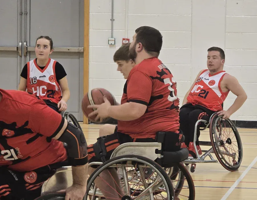 wheelchair basketball players in action on court